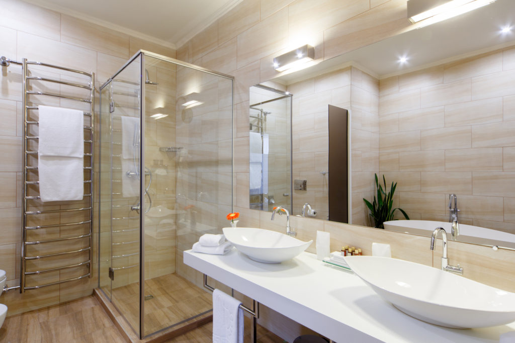 bathroom of the hotel rooms, with a shower and a few washbasins