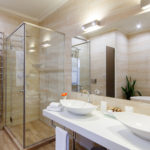 bathroom of the hotel rooms, with a shower and a few washbasins