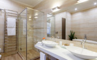 bathroom of the hotel rooms, with a shower and a few washbasins